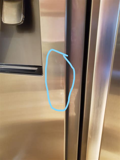 broken stainless steel fridge